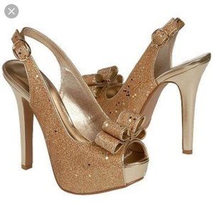 Night moves peep toe gold glitter heel.